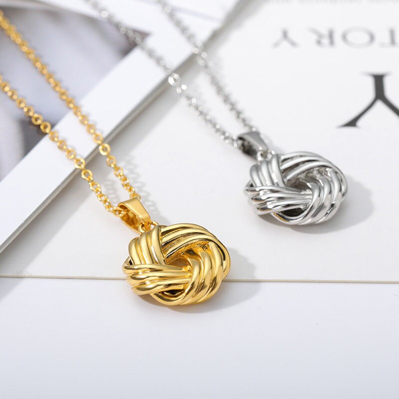 Silver And Gold Knot Pendant Necklace