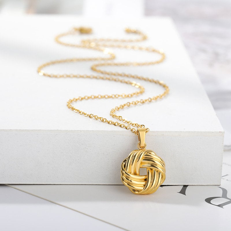 Silver And Gold Knot Pendant Necklace