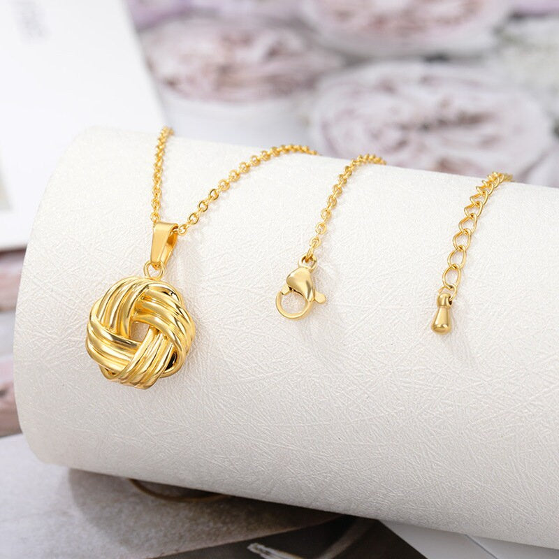 Silver And Gold Knot Pendant Necklace